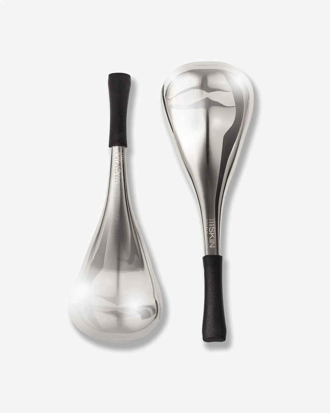 Two silver cryo facial massage tools with black handles