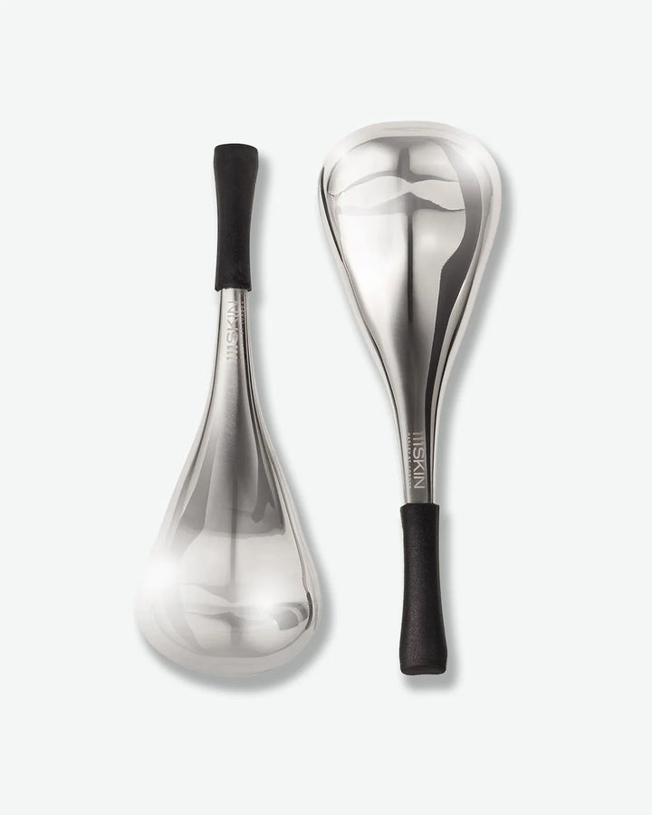Two silver cryo facial massage tools with black handles