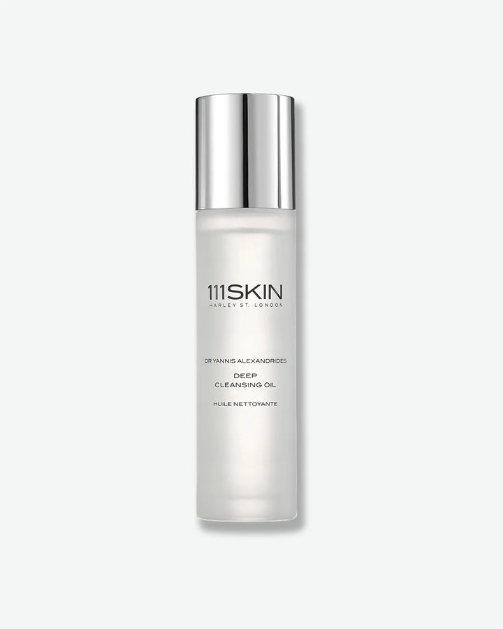Opaque white bottle of 111SKIN Deep Cleansing Oil with a silver cap on a white background