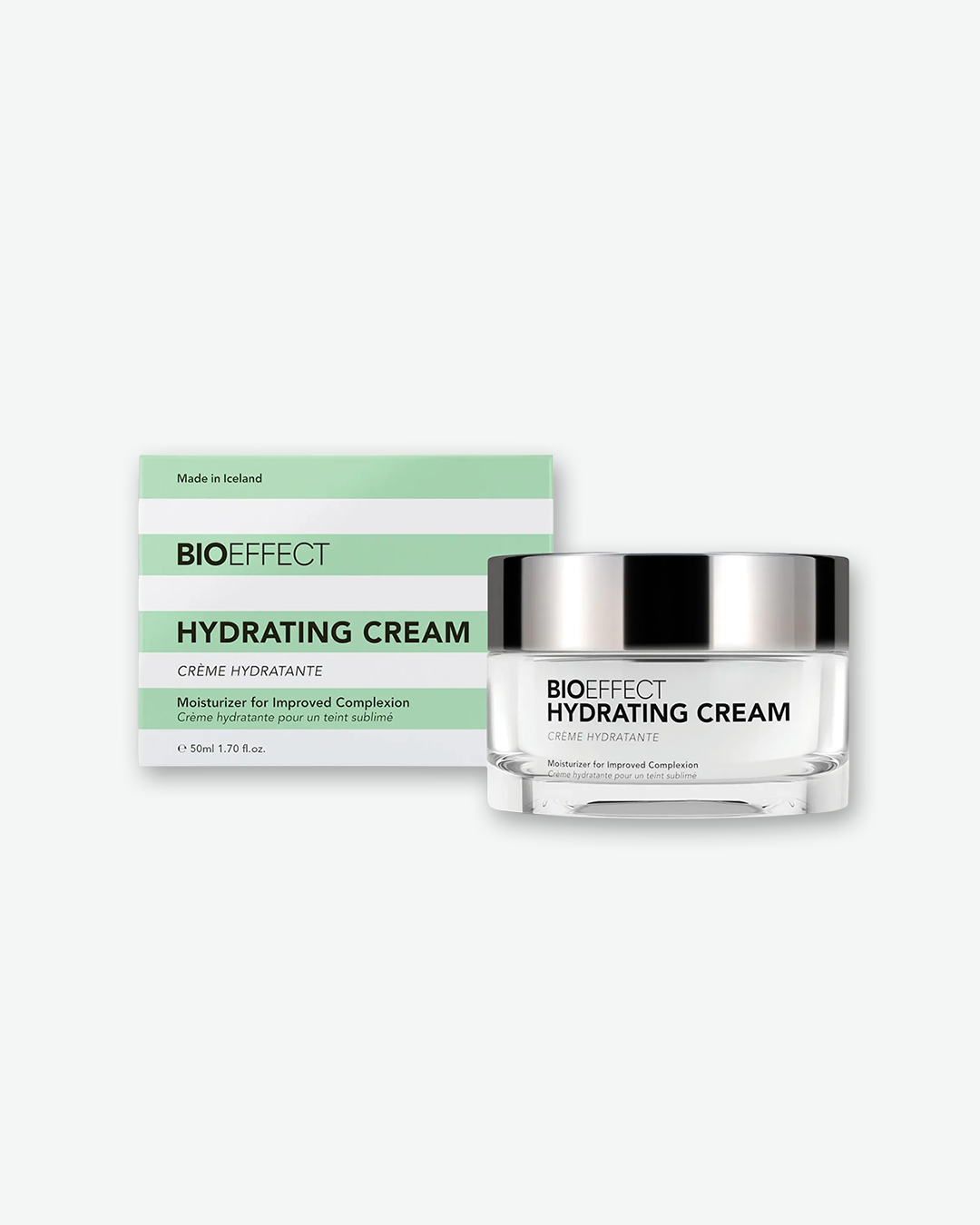 BIOEFFECT Hydrating Cream 50ml (1.70 fl. oz.) in a clear glass jar with a metallic silver cap, shown next to its green-and-white striped outer box.