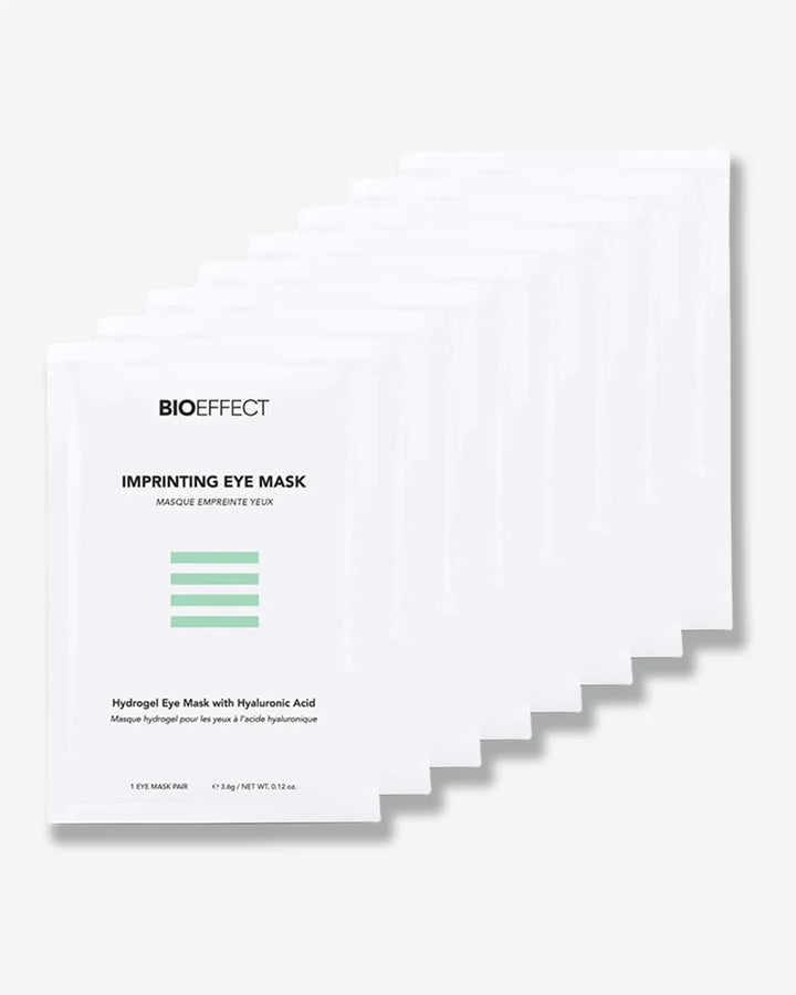 Multiple individual packets of white  BIOEFFECT Imprinting Eye Masks (single pairs) on a white background