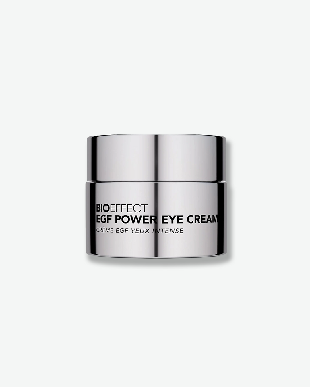 Front view of a Bioeffect EGF Power Eye Cream jar centered against a plain gray background. The compact skincare container is made of a highly polished, reflective silver metal with the brand and product name printed across the front in a bold black font.