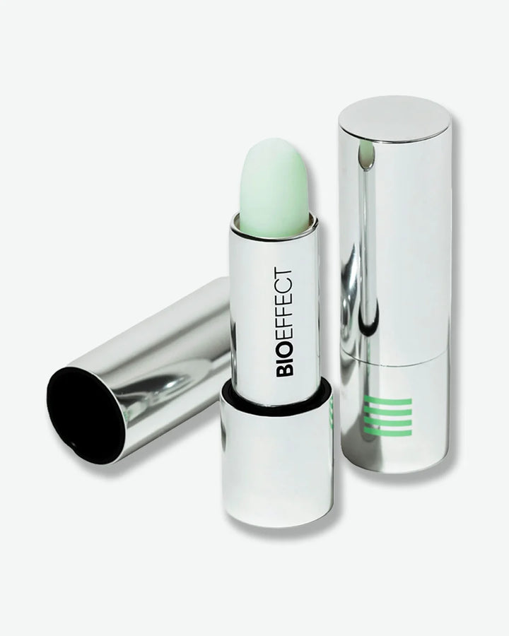 Mint green lip treatment with silver case on a white background, featuring the Bioeffect brand.