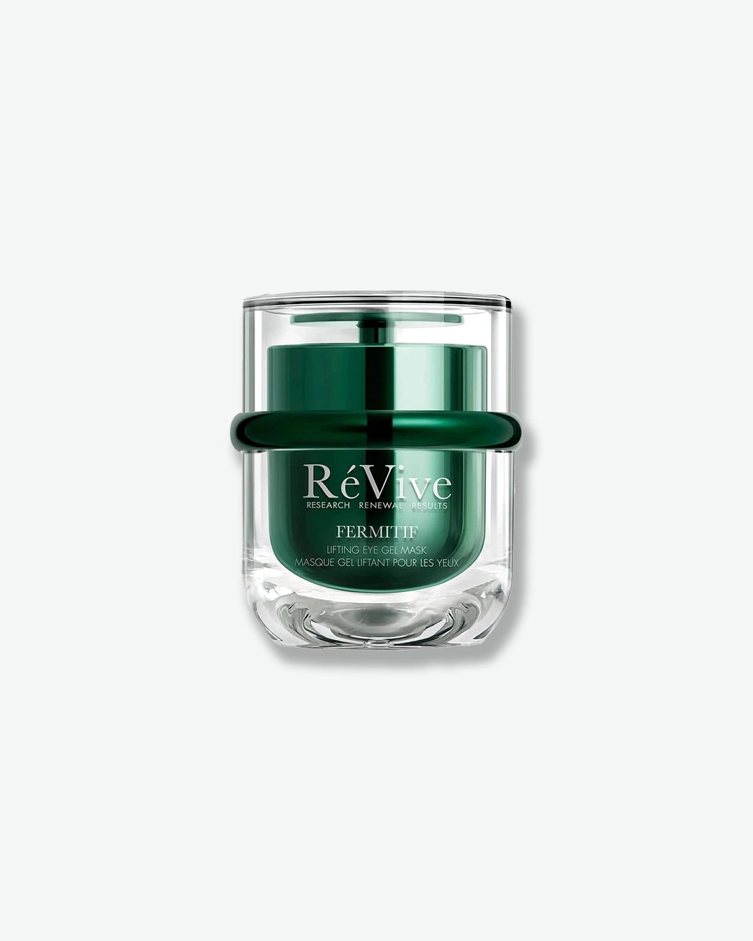A vertical product shot of the "RéVive Fermitif Lifting Eye Gel Mask" in a luxurious, double-walled clear glass jar with a metallic dark green inner container and a matching green band around the center.