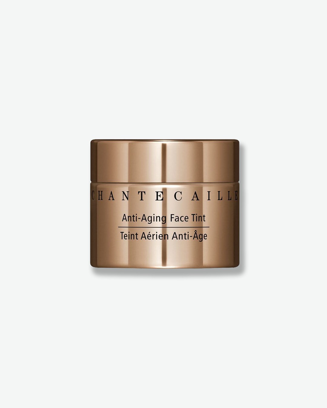Front view of a Chantecaille Anti-Aging Face Tint jar against a plain gray background. The cylindrical cosmetic jar features a reflective, metallic bronze finish with the brand name and product title printed in black text.