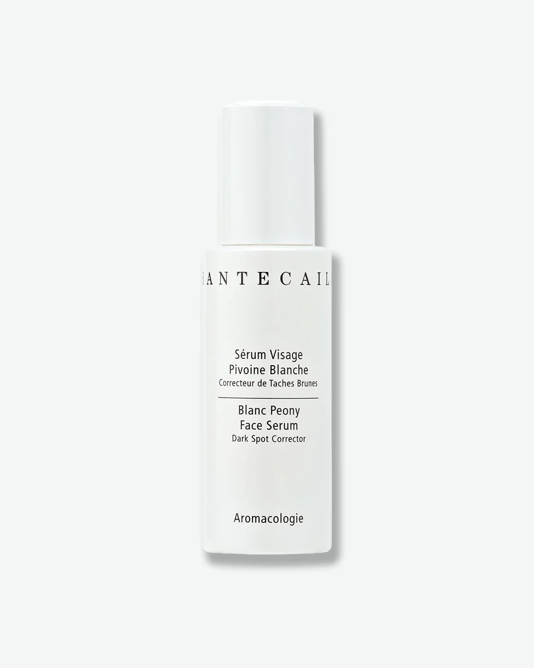 White face serum bottle with text on a white background