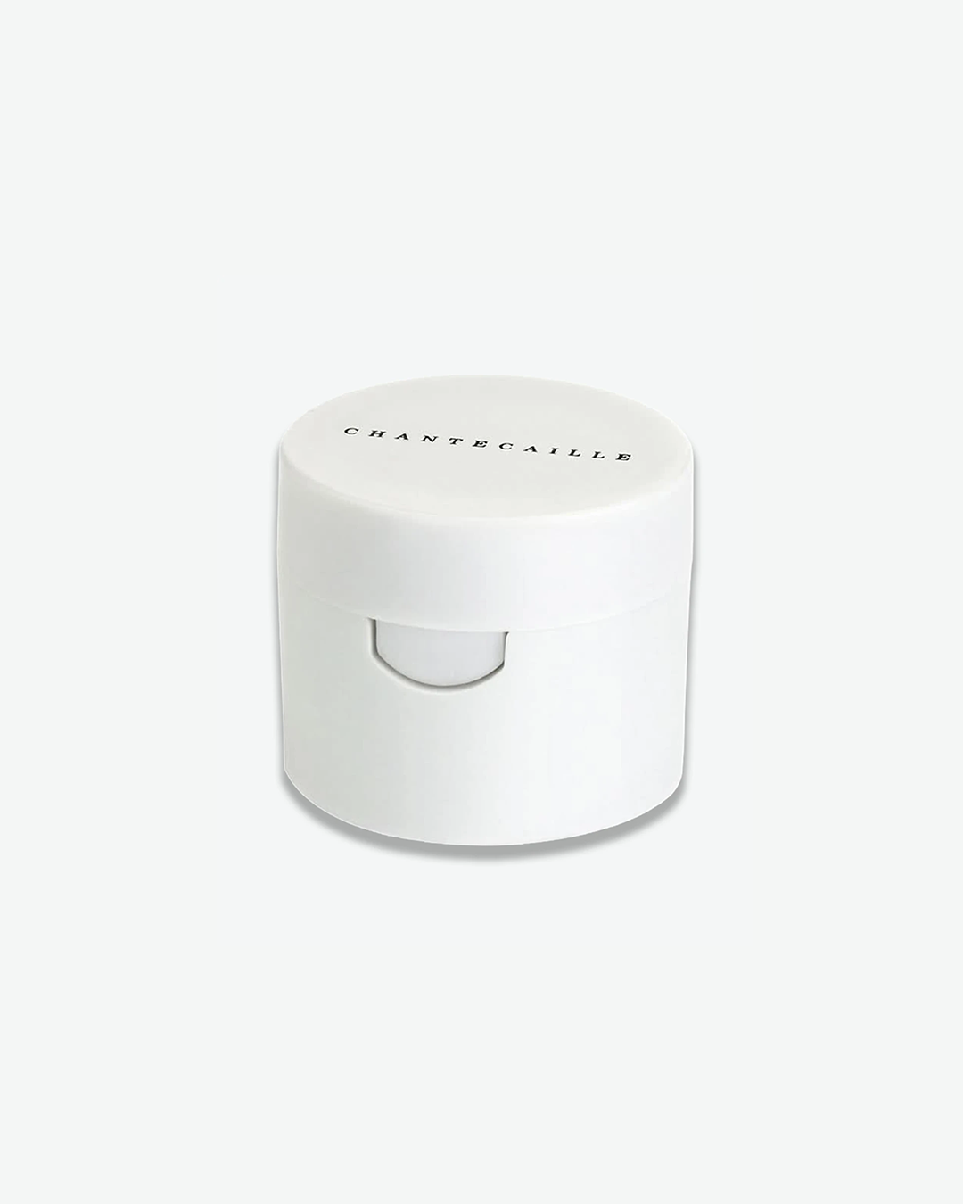 A small, minimalist Chantecaille opaque white round container with its black logo printed on the lid.