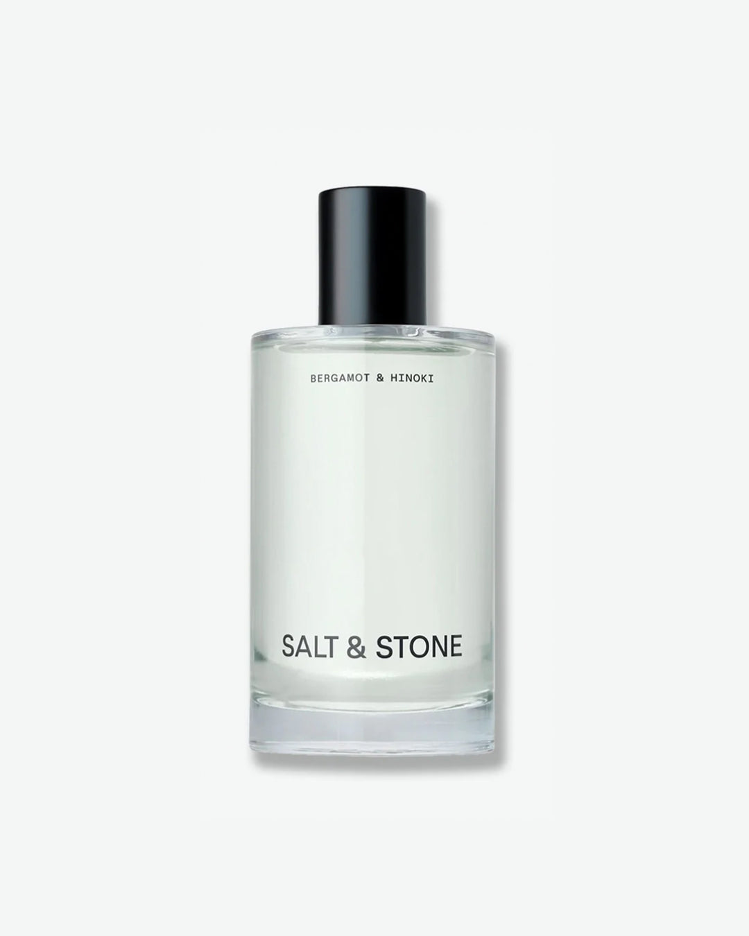 Salt & Stone Bergamot & Hinoki product in a minimalist clear glass bottle with a black cylindrical cap and bold black branding, isolated against a light grey background.