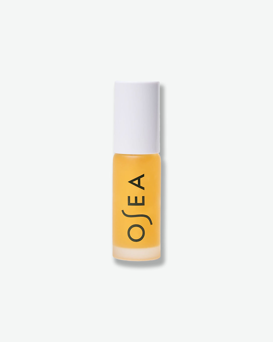 Yellow skincare stick with white cap on a white background, featuring the OSEA brand.