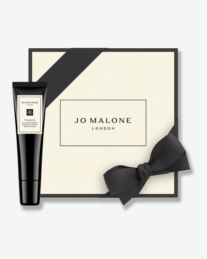 Jo Malone London gift set with black tube and bow on a white background