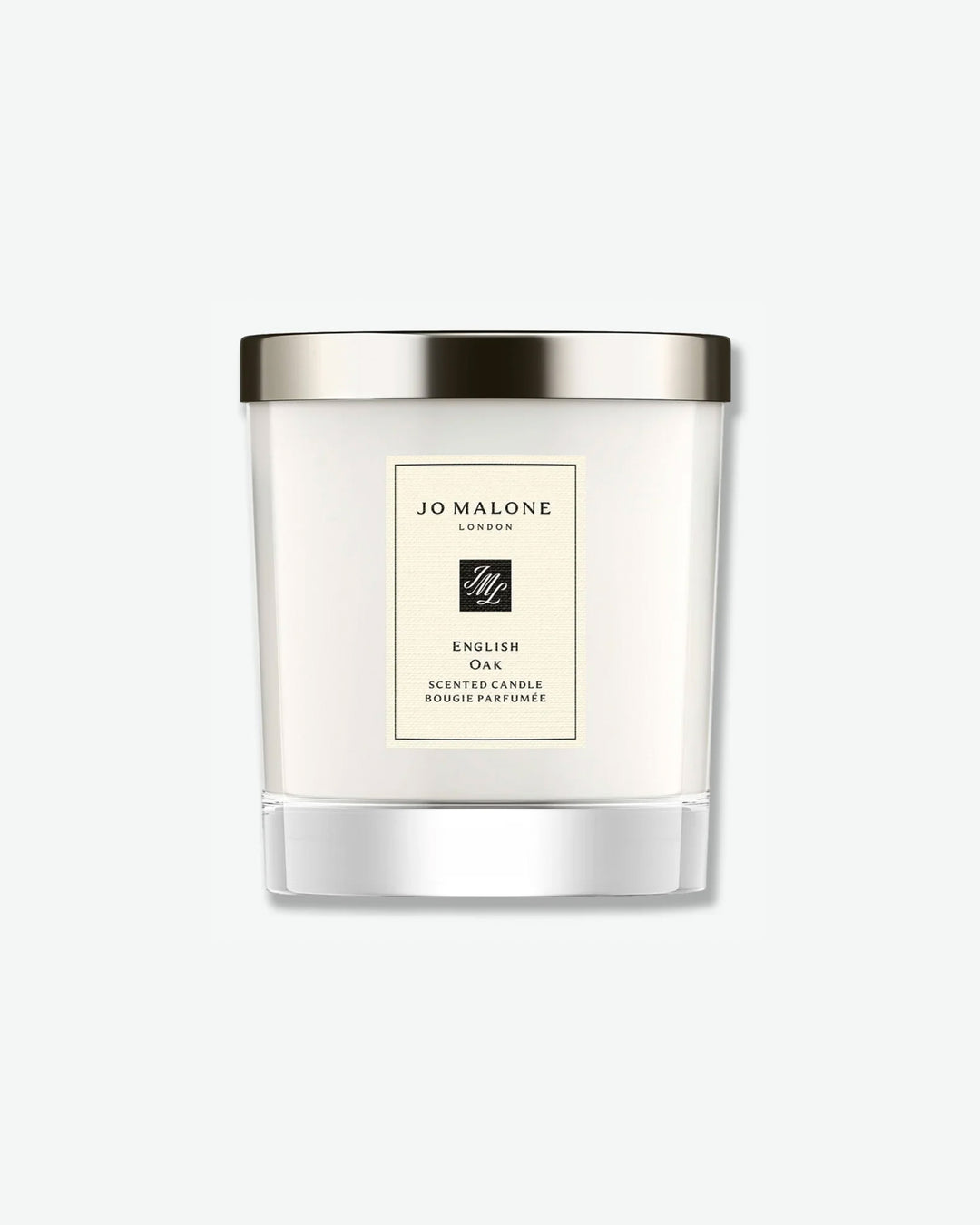 Jo Malone English Oak scented candle in a glass jar with silver lid on a white background