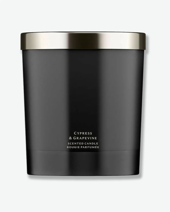 Jo Malone Cypress & Grapevine scented candle in a matte black glass jar with silver lid on a white background
