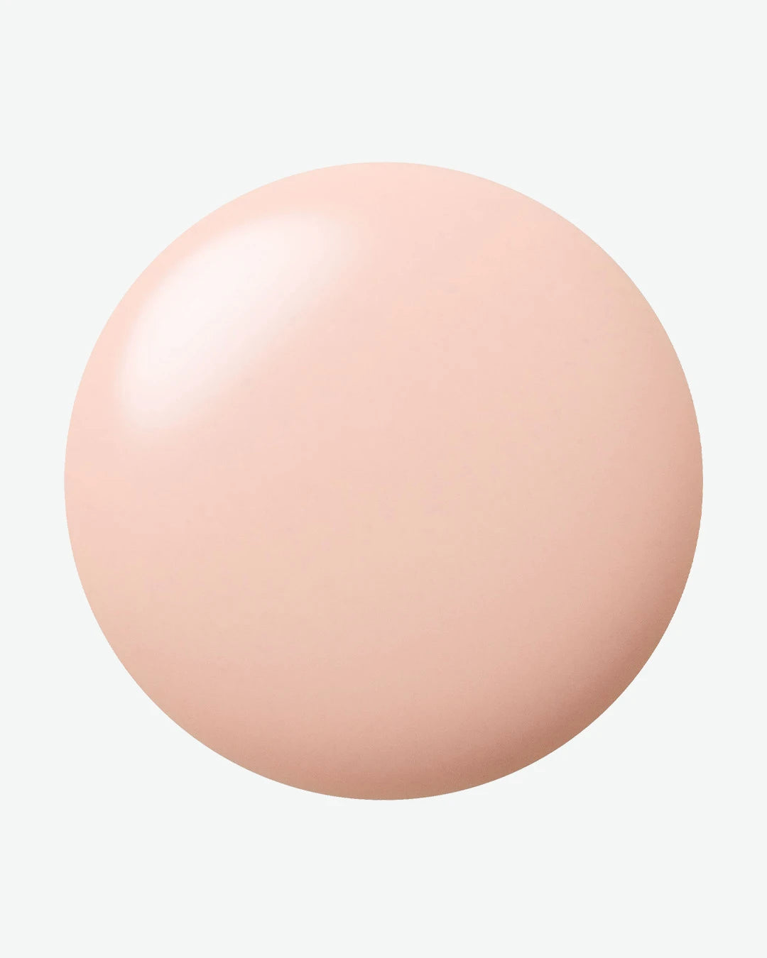 Round beige droplet on a white background