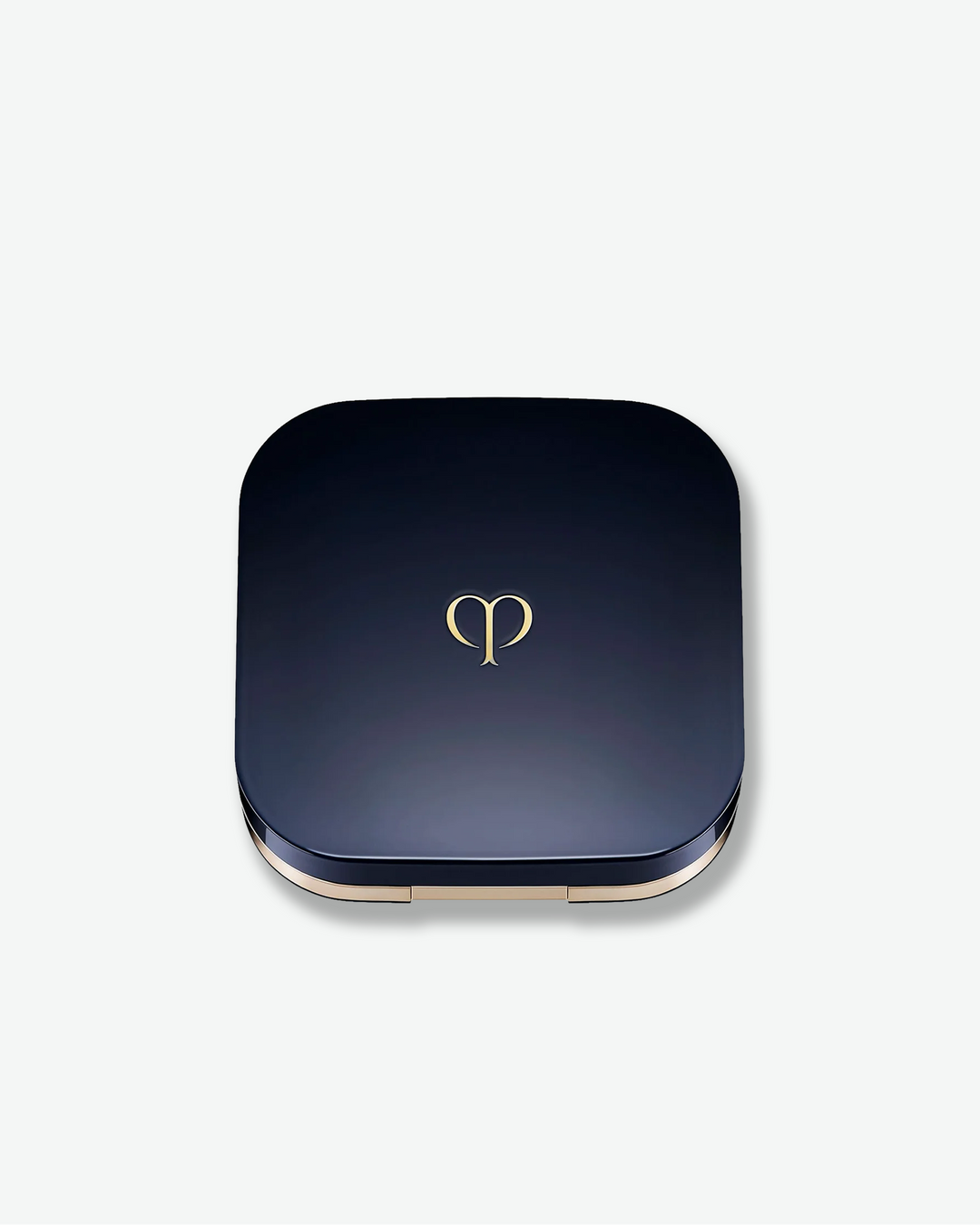 Blue compact powder case with a gold logo on a white background