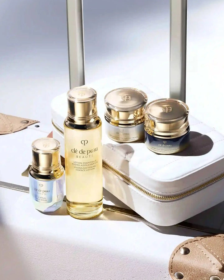 Cosmetic set with bottles and jars on a white surface