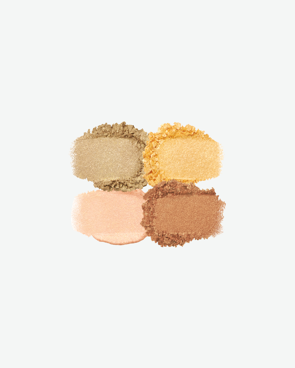 Swatches of four Clé de Peau Beauté eyeshadows in shimmering champagne, golden yellow, soft peach, and bronze.