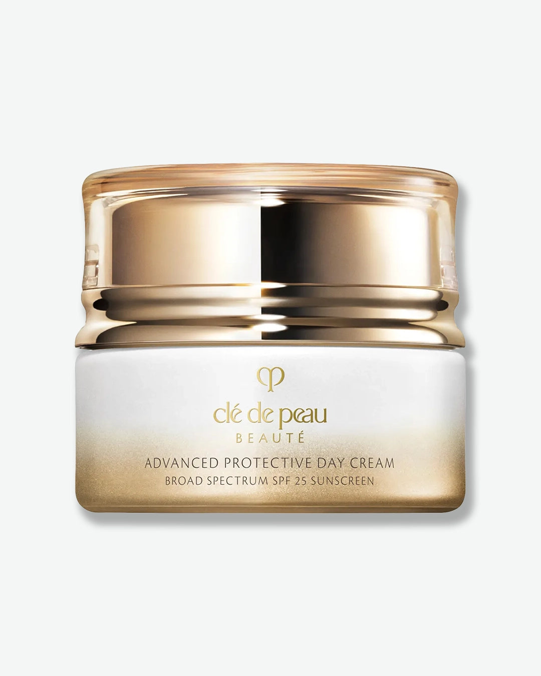 A jar of Clé de Peau Beauté Advanced Protective Day Cream Broad Spectrum SPF 25 Sunscreen, featuring a white-to-gold gradient glass base and a reflective gold-toned lid.