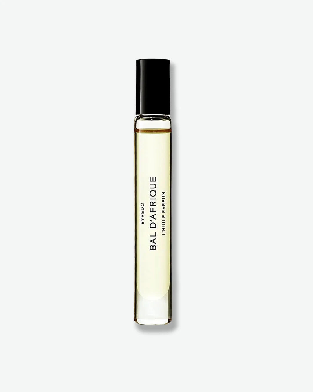 Perfume roll-on vial labeled 'Bal d'Afrique' by Byredo on a light gray background