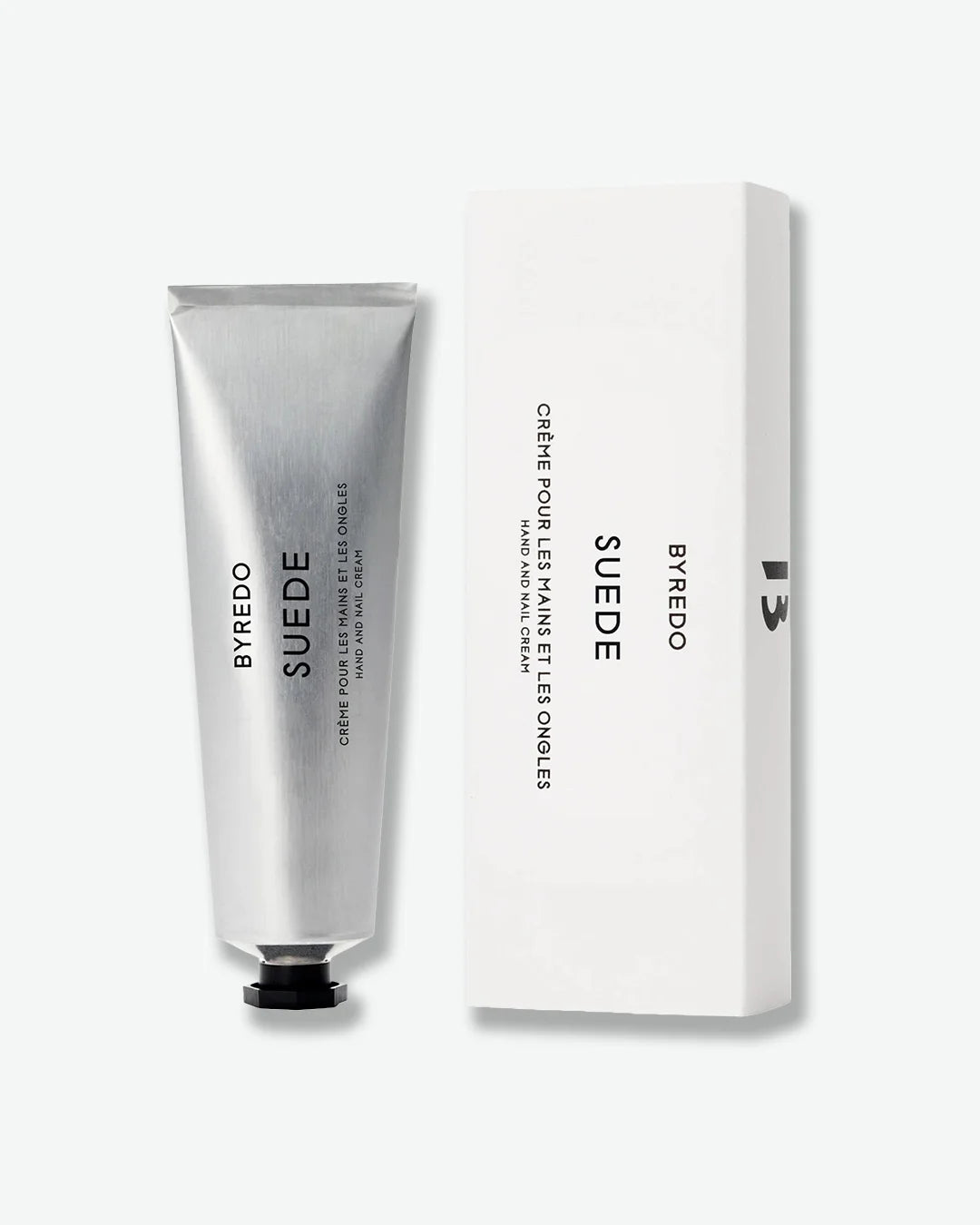 Aluminum Byredo Suede hand cream tube with packaging on a white background