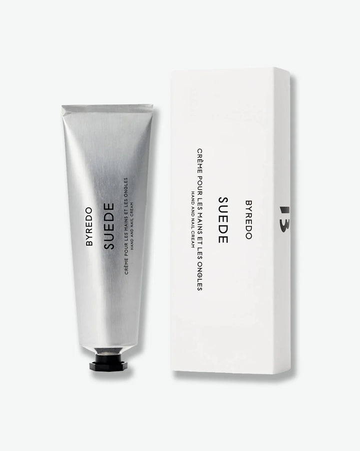 Aluminum Byredo Suede hand cream tube with packaging on a white background
