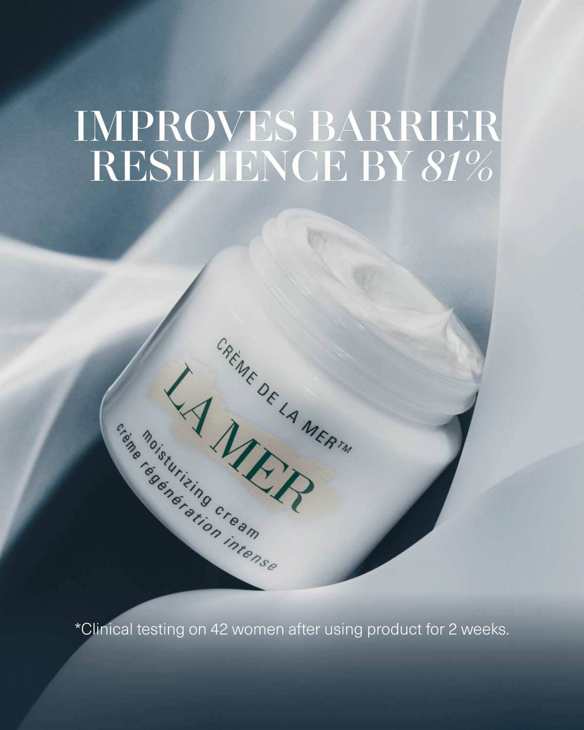 Open jar of Crème de la Mer against soft blue fabric with text stating it improves skin barrier resilience by 81%.