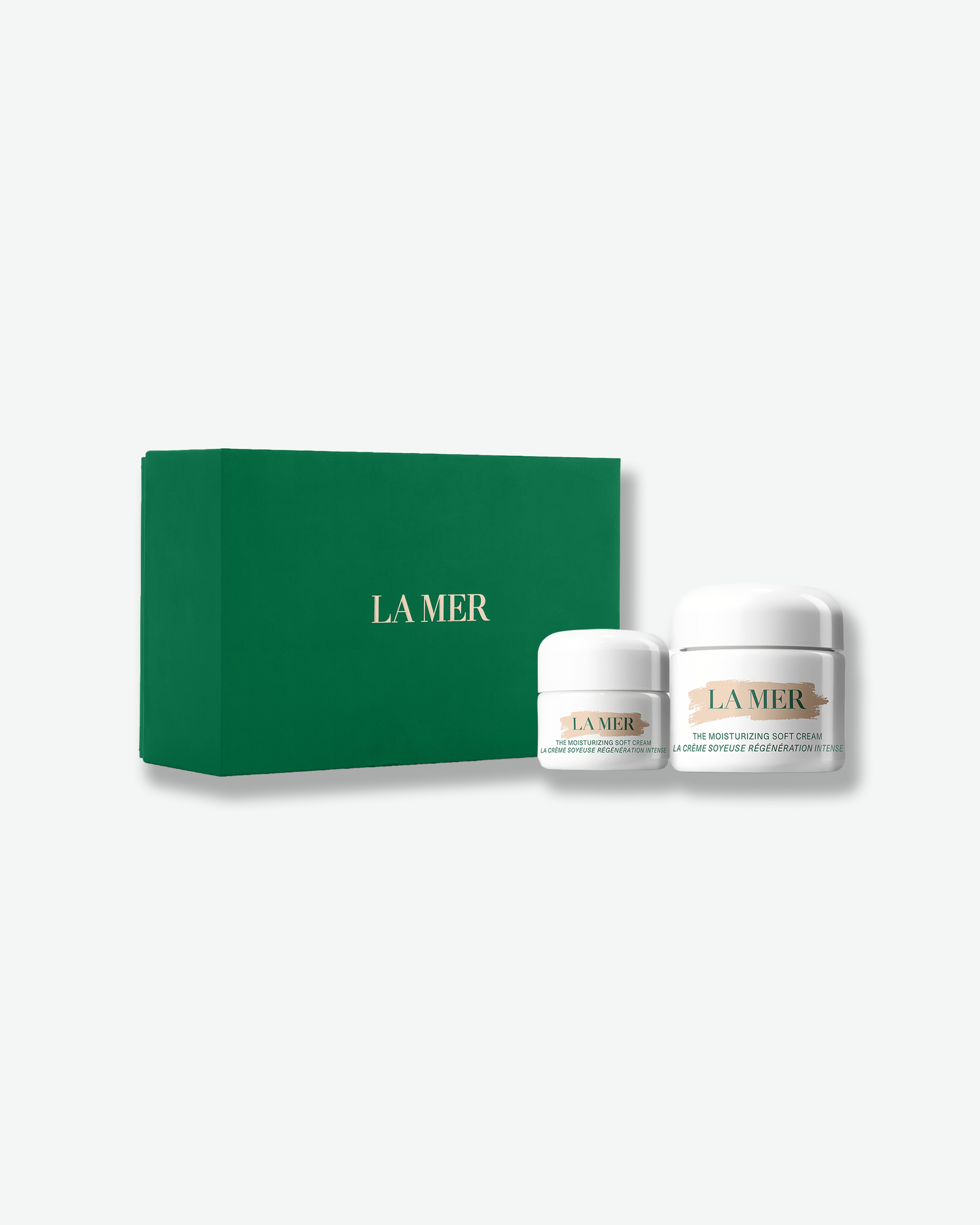 La Mer The Moisturizing Soft Cream set featuring two cream jars alongside a signature green La Mer gift box.