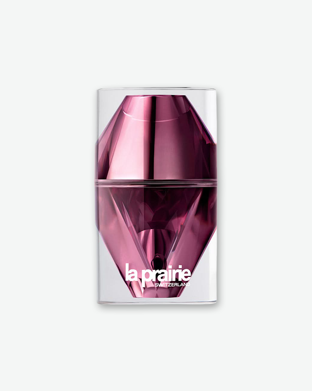 La Prairie Switzerland skincare product encased in a futuristic, diamond-faceted metallic pink and magenta structural bottle inside a clear cylindrical outer shell, isolated on a light grey background.