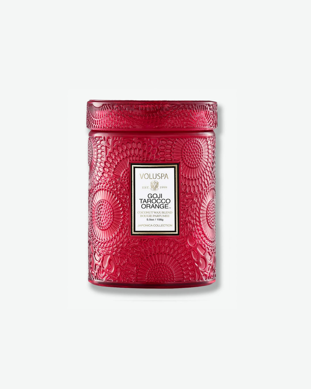 Front view of a Voluspa Baltic Amber small jar candle against a plain gray background. The warm, amber-colored glass vessel is completely detailed with an embossed floral pattern and capped with a matching textured glass screw-on lid.