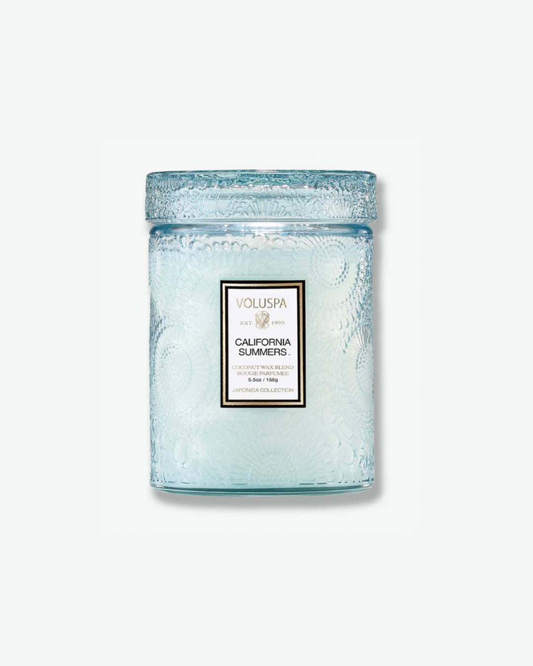 Front view of a Voluspa California Summers small jar candle against a plain gray background. The translucent, light icy-blue glass vessel is completely detailed with an embossed floral pattern and capped with a matching textured glass screw-on lid.