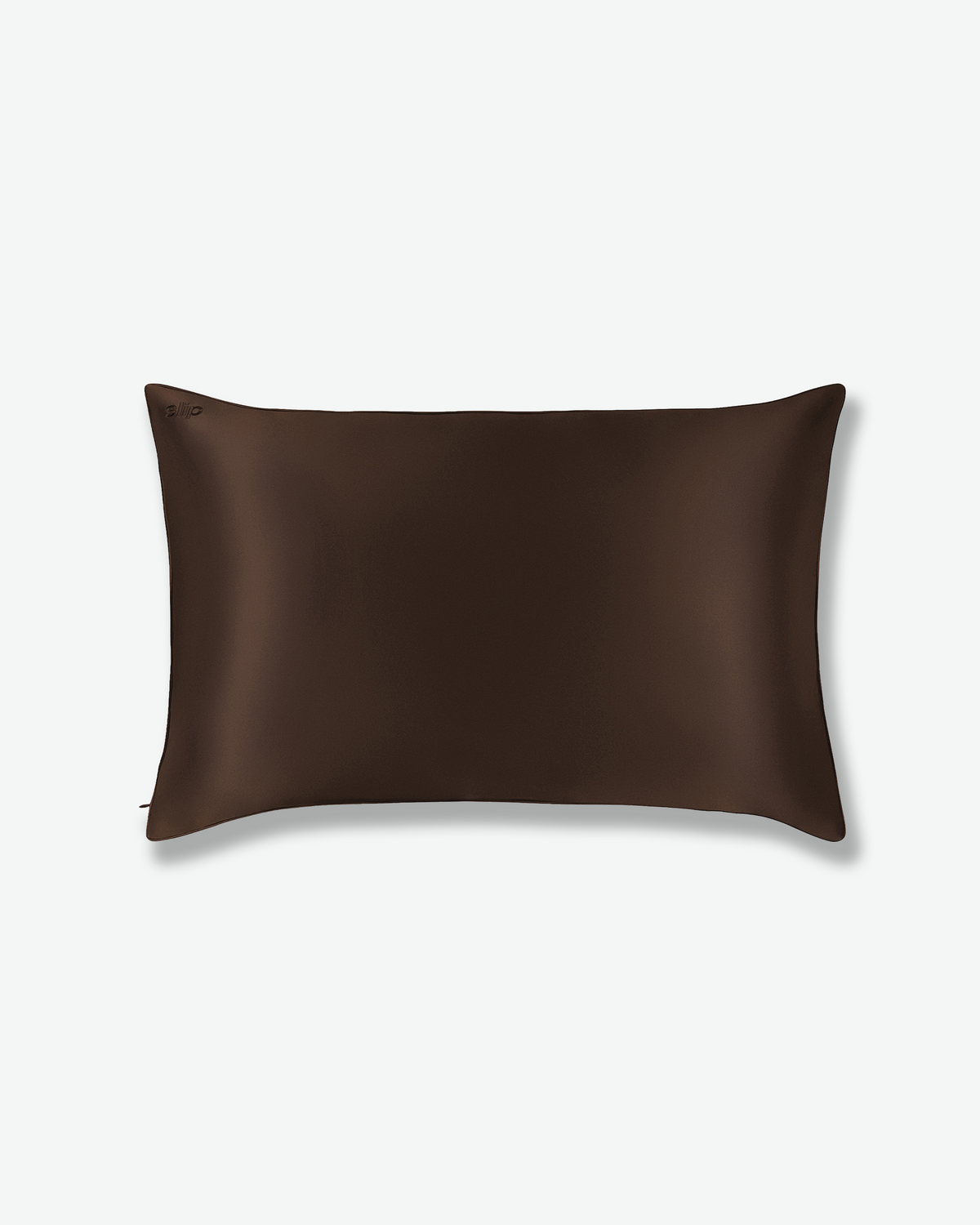 Slip Pure Silk Pillowcase in rich chocolate brown, featuring a smooth, luxurious silk finish and subtle Slip logo on a light gray background.