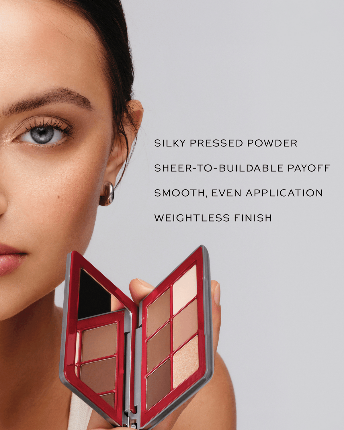 Model holding the Westman Atelier eyeshadow palette beside text highlighting the silky pressed powder, buildable payoff, smooth application, and weightless finish.