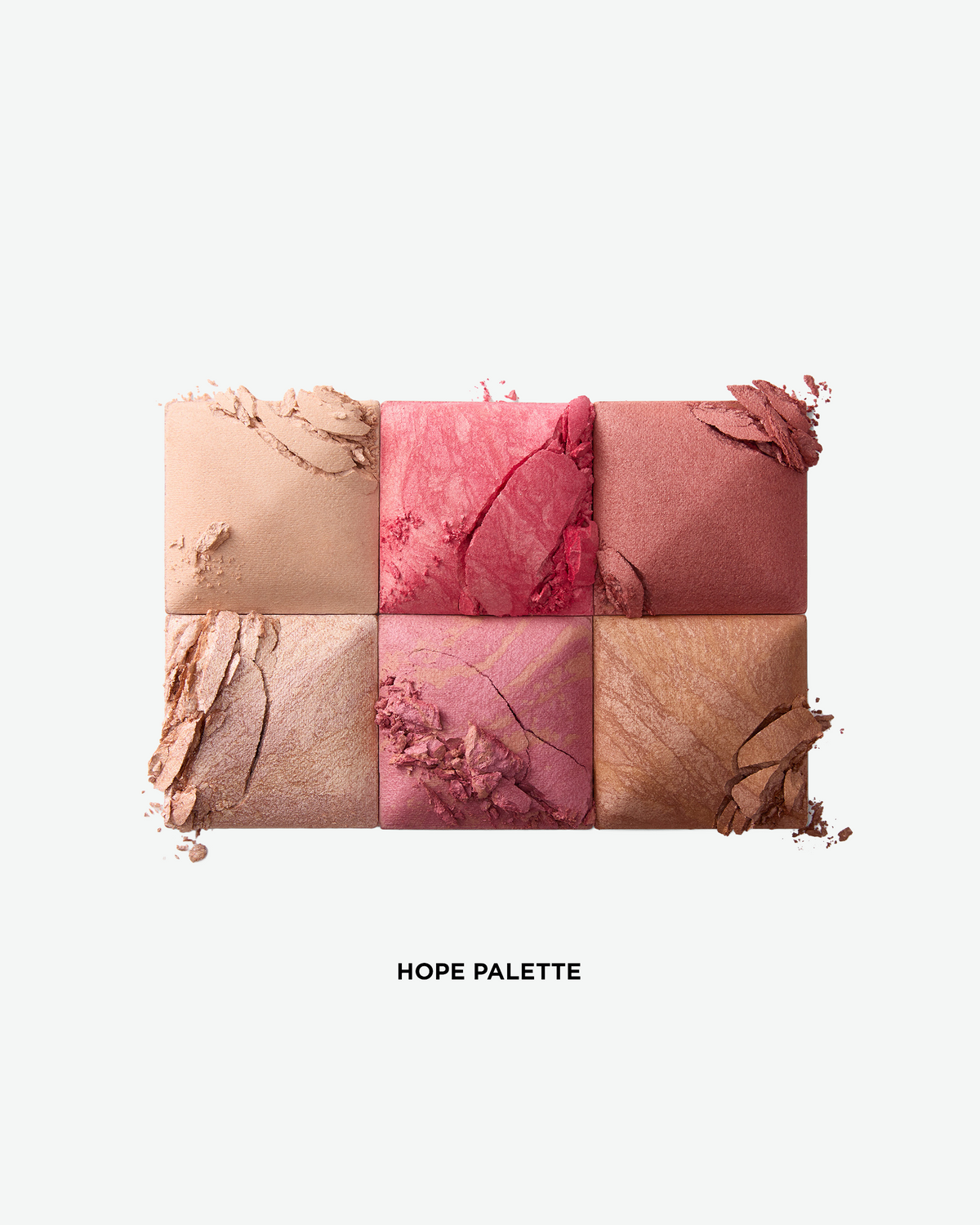 Close-up of the six shades in the Hourglass Ambient Lighting Edit – Unlocked Palette in Hope, featuring finishing powder, blush, highlighter, and bronzer tones.