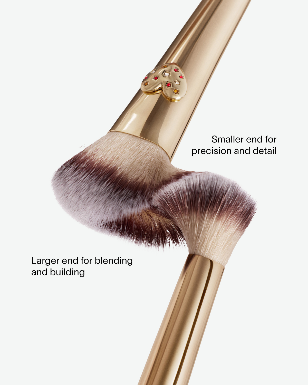 Close-up of the Hourglass Ambient Lighting Edit Brush II showing the larger end for blending and building and the smaller end for precision and detail.