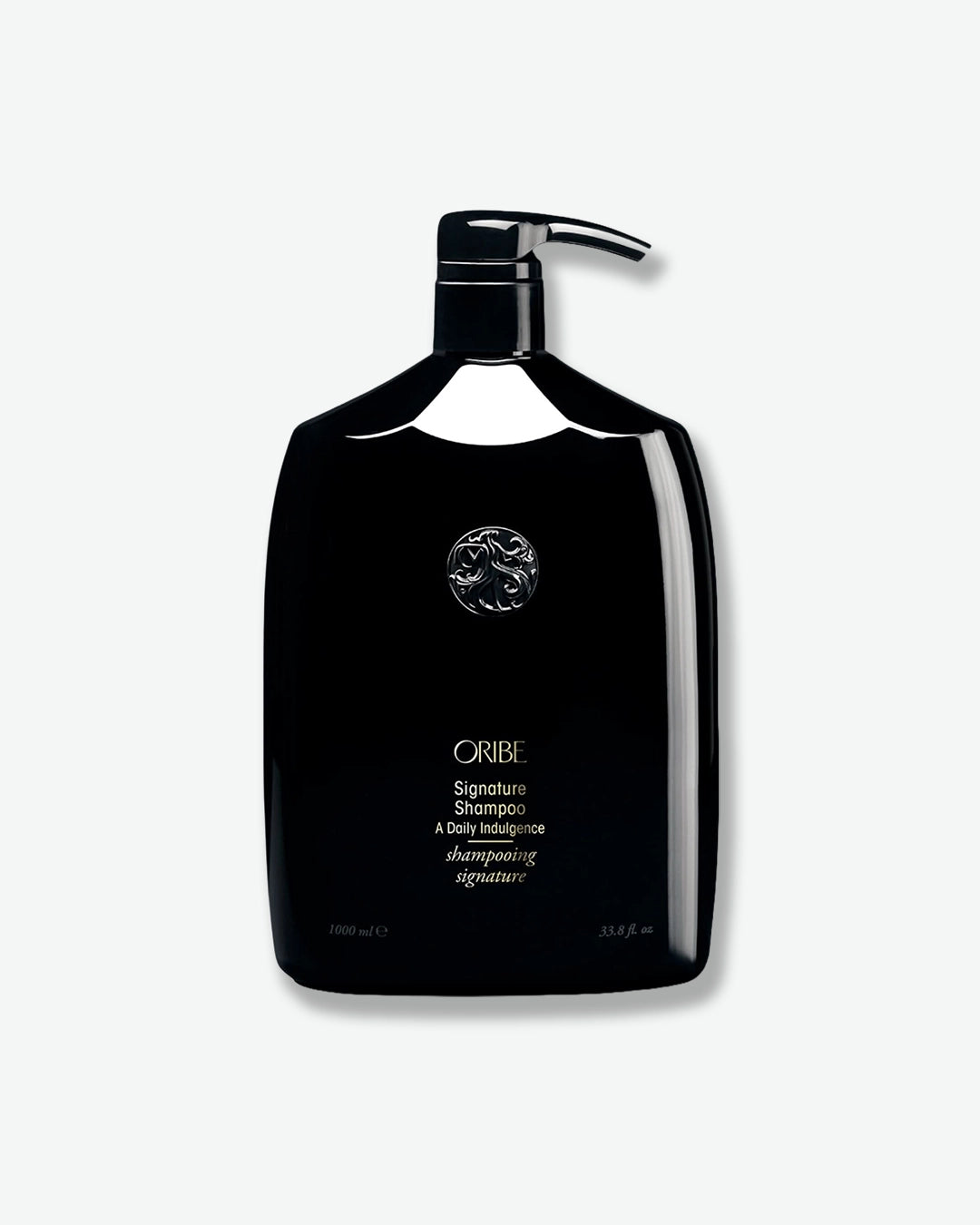 Black shampoo bottle with pump on a white background