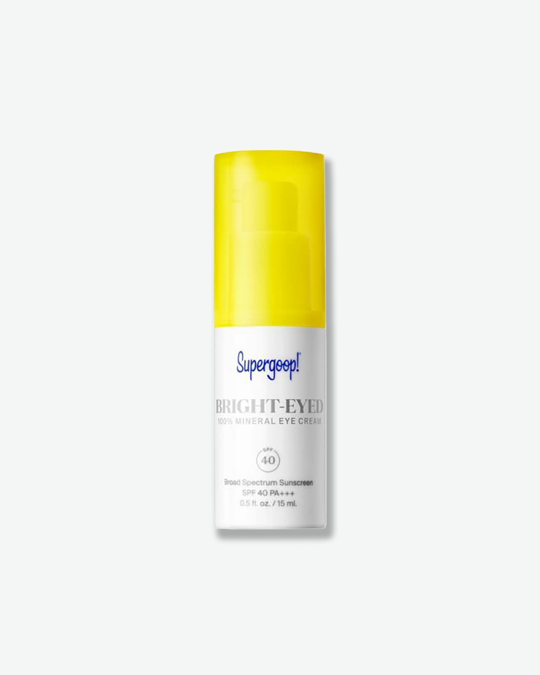 Supergoop! Bright-Eyed 100% Mineral Eye Cream SPF 40 in a small white pump bottle topped with a translucent vibrant yellow cap, isolated on a light grey background.