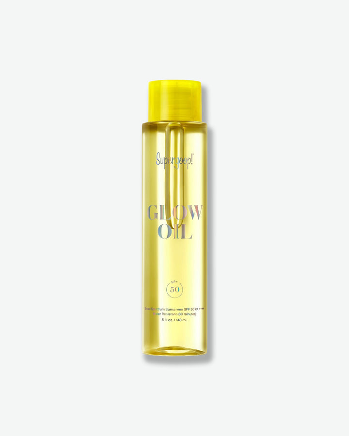 Yellow bottle of 'Glow Oil' with a yellow cap on a white background