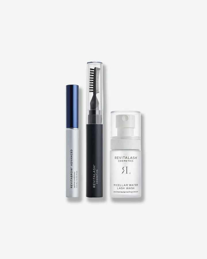 Revitalash cosmetic products including a mascara, eyeliner, and micellar water on a white background