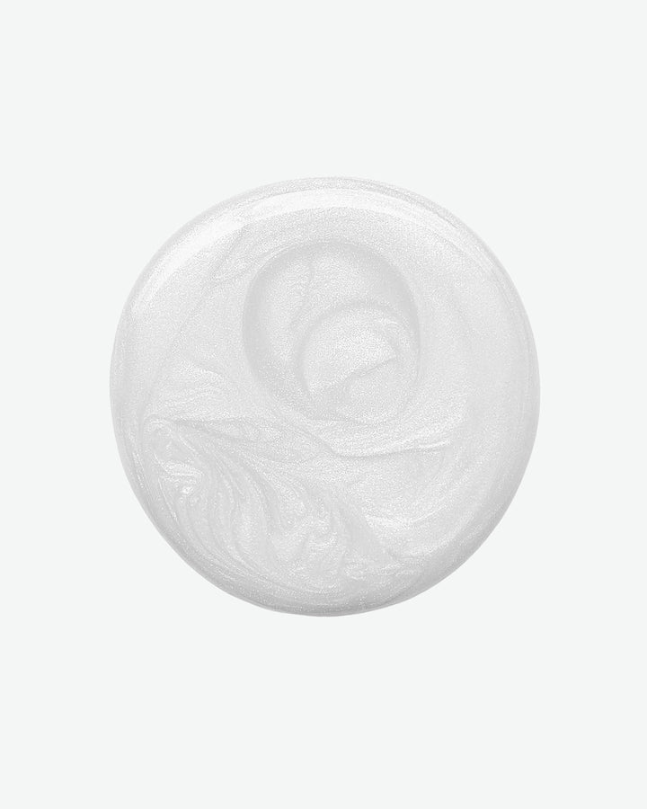 White cream in a round container on a white background