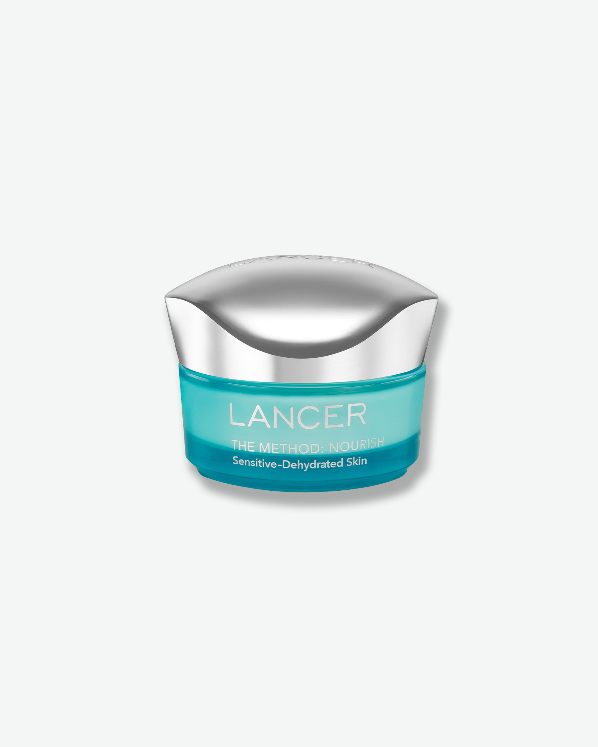 Front view of a Lancer skincare jar for "The Method: Nourish" moisturizer formulated for Sensitive-Dehydrated Skin. The design consists of a translucent teal-blue base featuring white text, topped with a custom-contoured, high-shine chrome cap.