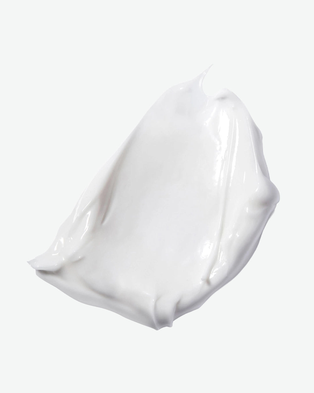 White gel or cream swatch on a light gray background