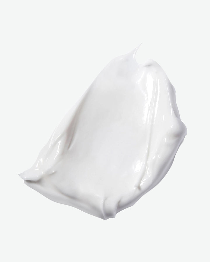 White gel or cream swatch on a light gray background