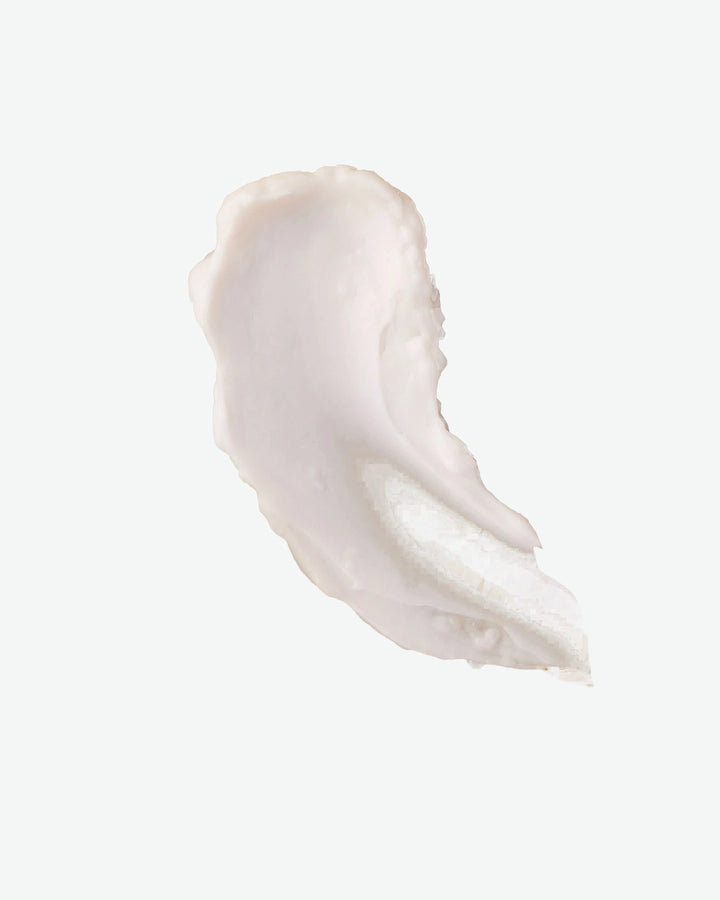 White cream swatch on a light beige background