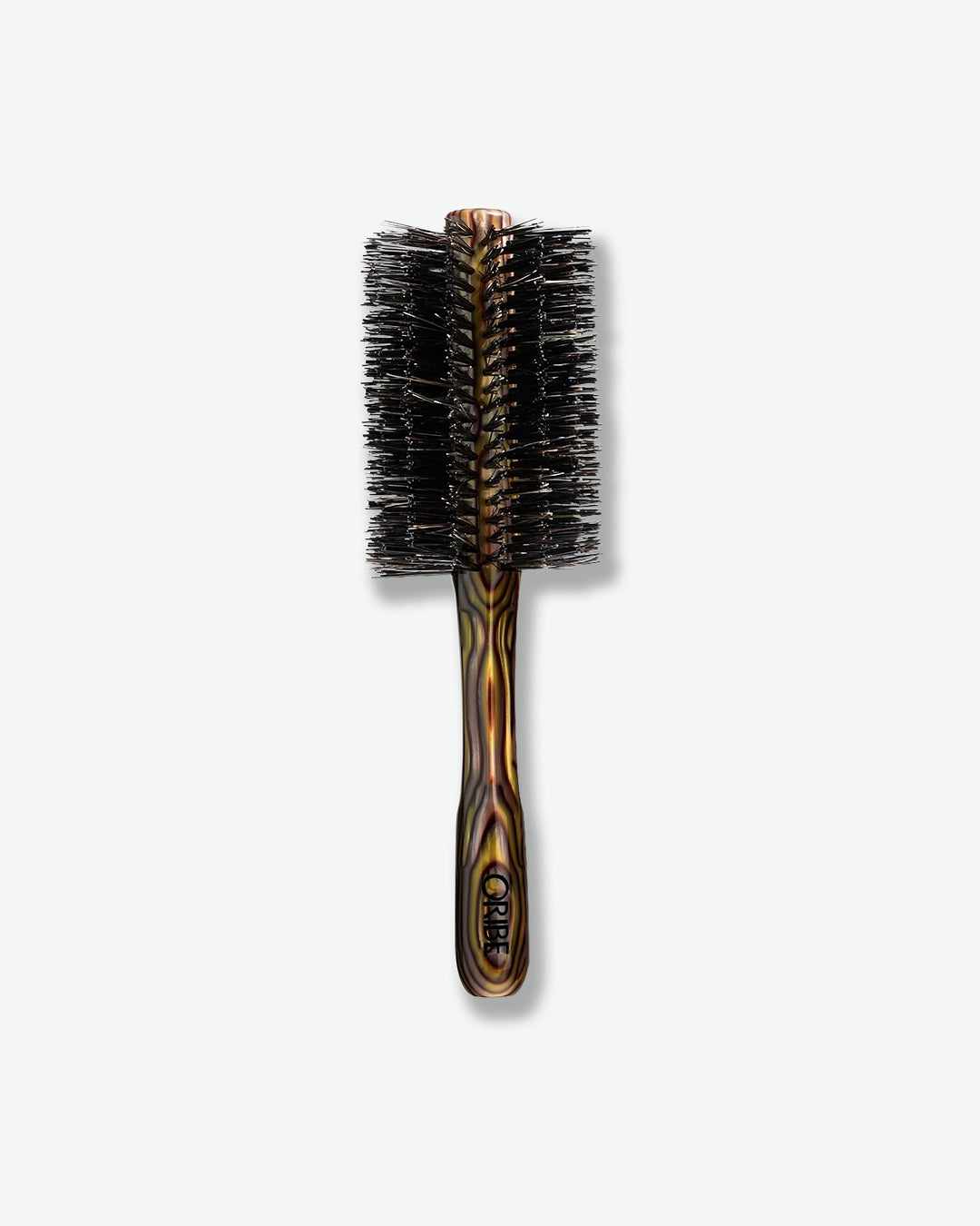 Round hairbrush with tortoiseshell handle on a white background