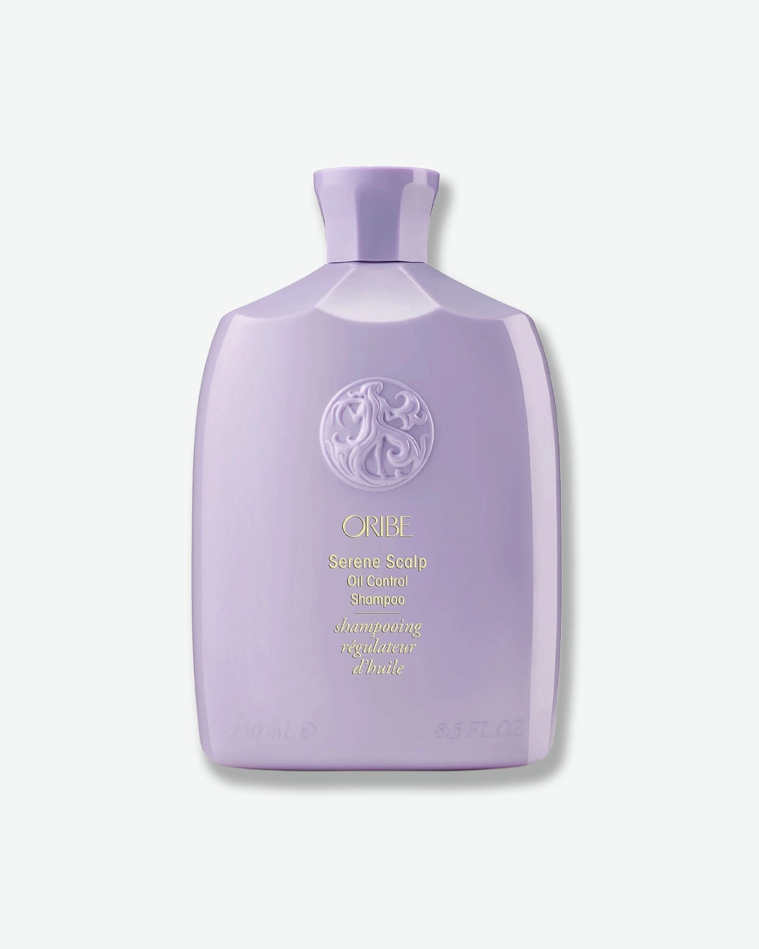 Purple shampoo bottle with brand logo on a white background