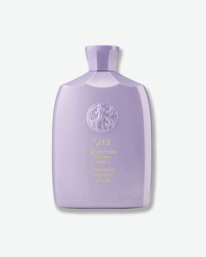 Purple shampoo bottle with brand logo on a white background