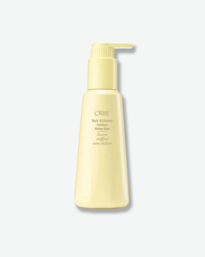 Yellow bottle with pump on a white background