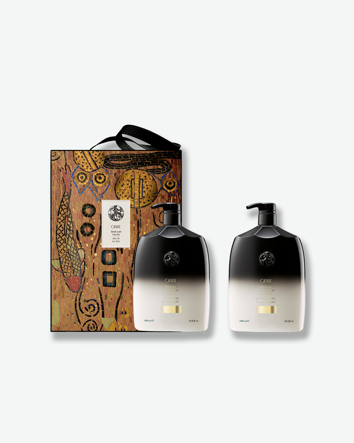 Oribe Gold Lust Liter Duo featuring 33.8 oz Gold Lust Repair & Restore Shampoo and Conditioner with limited-edition holiday gift packaging.