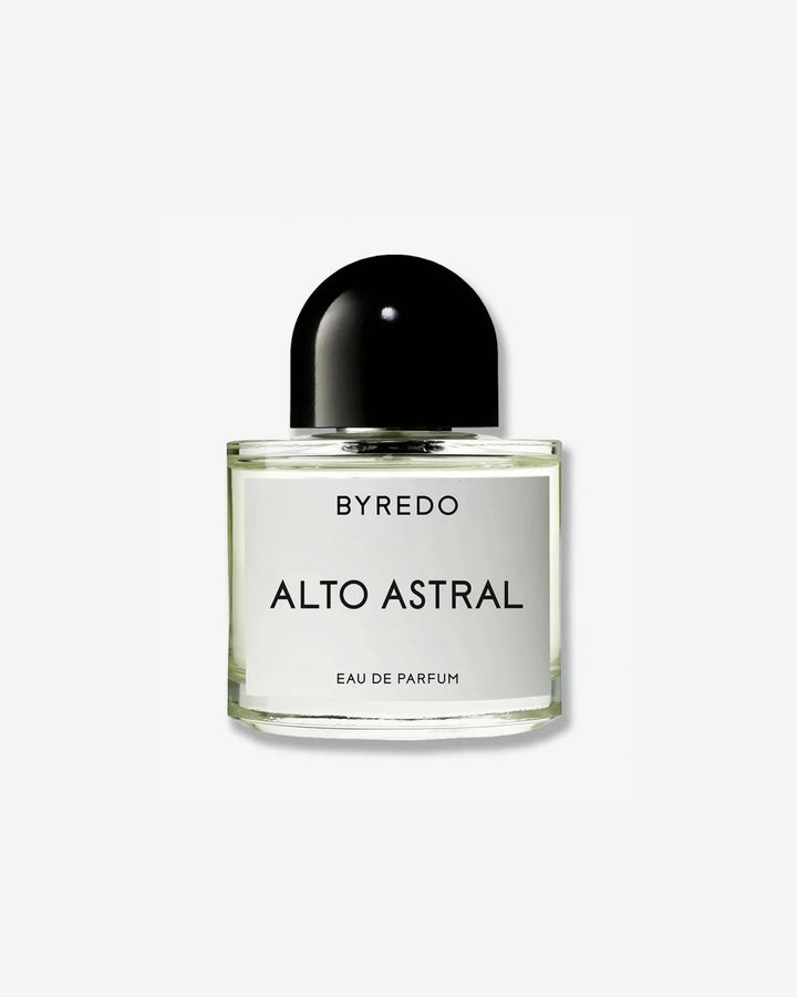 A minimalist, clear glass perfume bottle from Byredo, featuring a glossy, dome-shaped black cap. The rectangular white label reads "BYREDO" at the top, "ALTO ASTRAL" in large black lettering in the center, and "EAU DE PARFUM" in smaller text at the bottom, set against a plain light grey background.