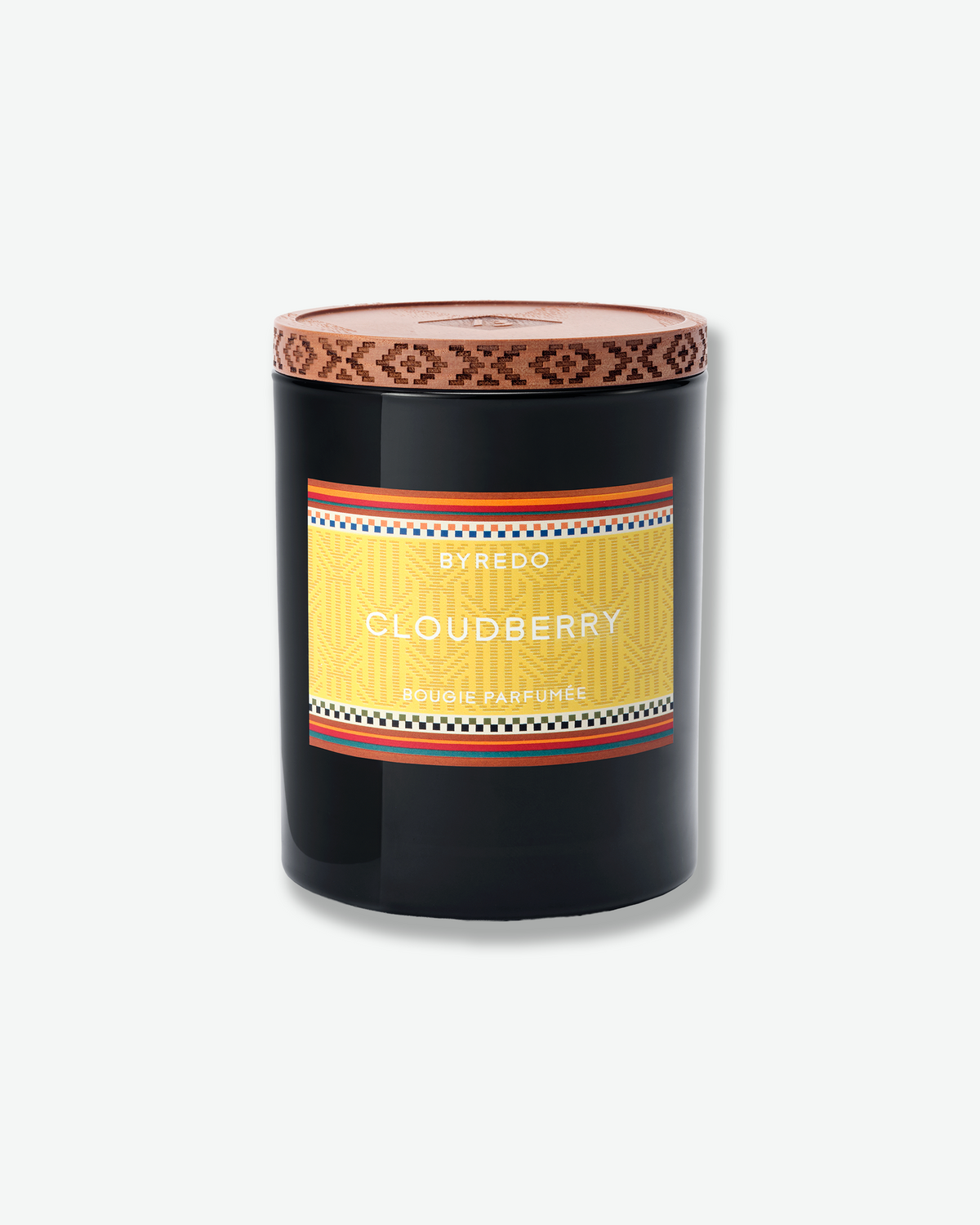 Byredo Cloudberry scented candle in a black glass vessel with a patterned wooden lid and colorful yellow label.