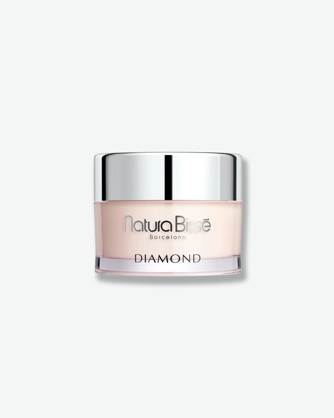 Front view of a Natura Bissé Diamond cream jar against a plain gray background. The cylindrical container features a smooth, very pale pinkish-cream base with silver text branding, capped with a reflective, polished silver metallic lid.